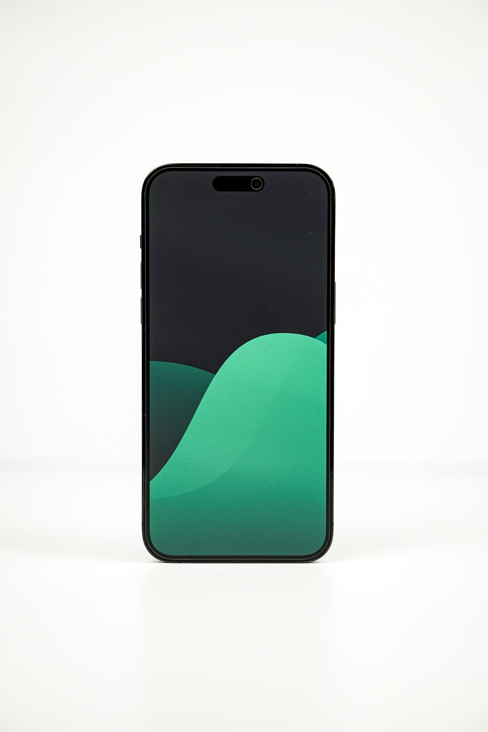 a black and green cell phone on a white surface