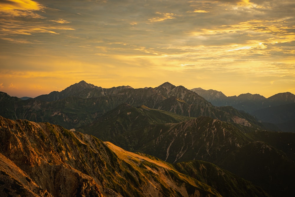 a view of a mountain range at sunset