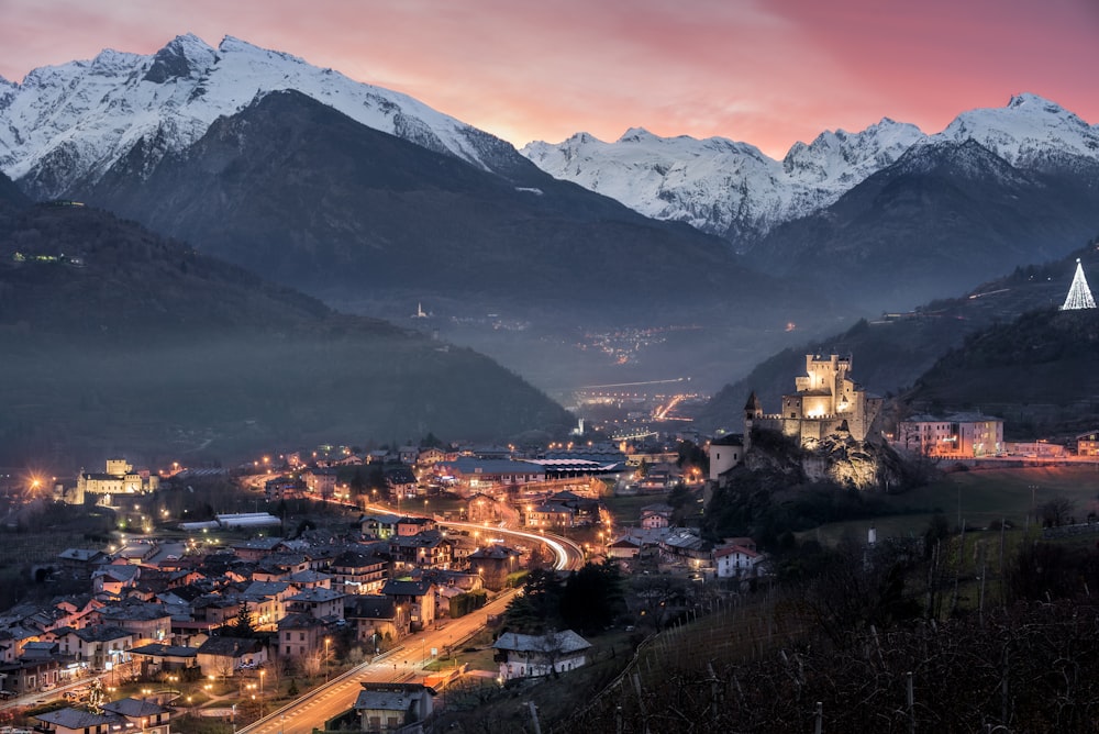 a view of a city with mountains in the background