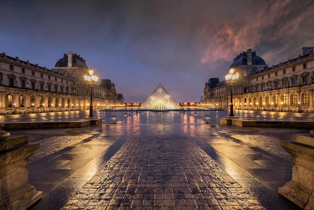 a large building with a pyramid in the middle of it