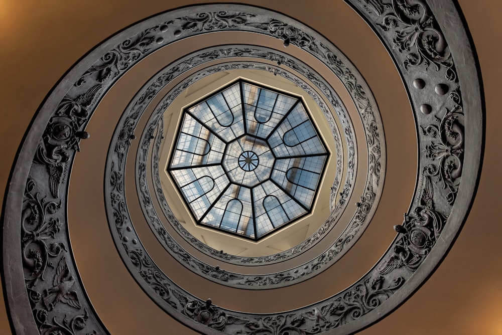 a circular ceiling with a skylight in the center
