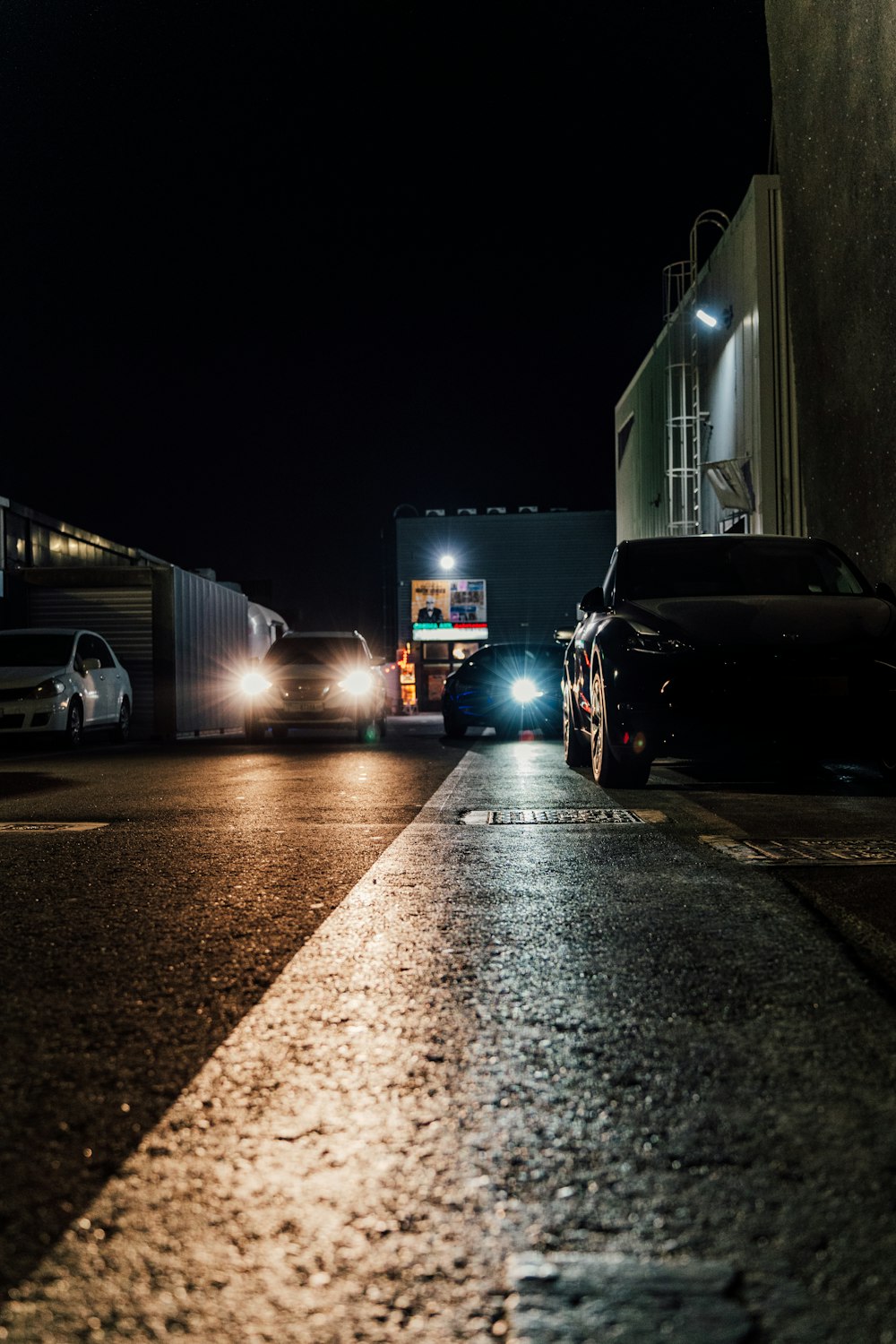 a couple of cars parked on the side of a road