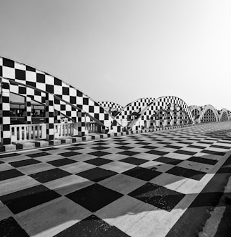 a black and white photo of a checkered floor