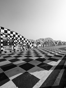 a black and white photo of a checkered floor