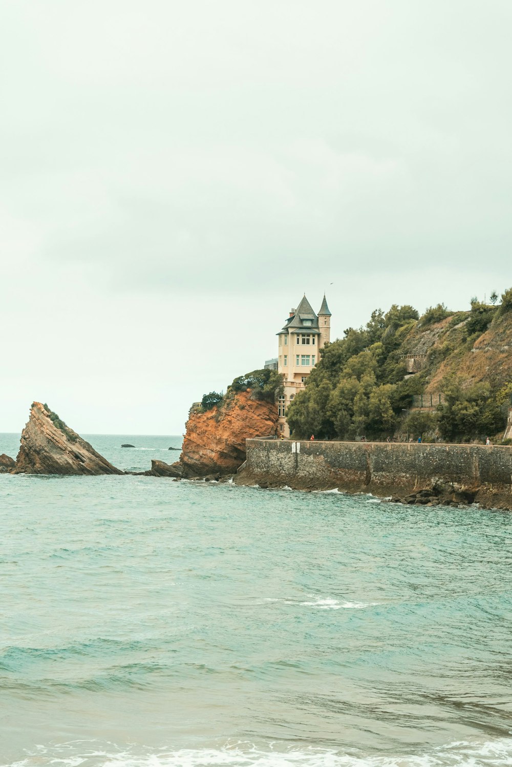 a large body of water with a building on top of it