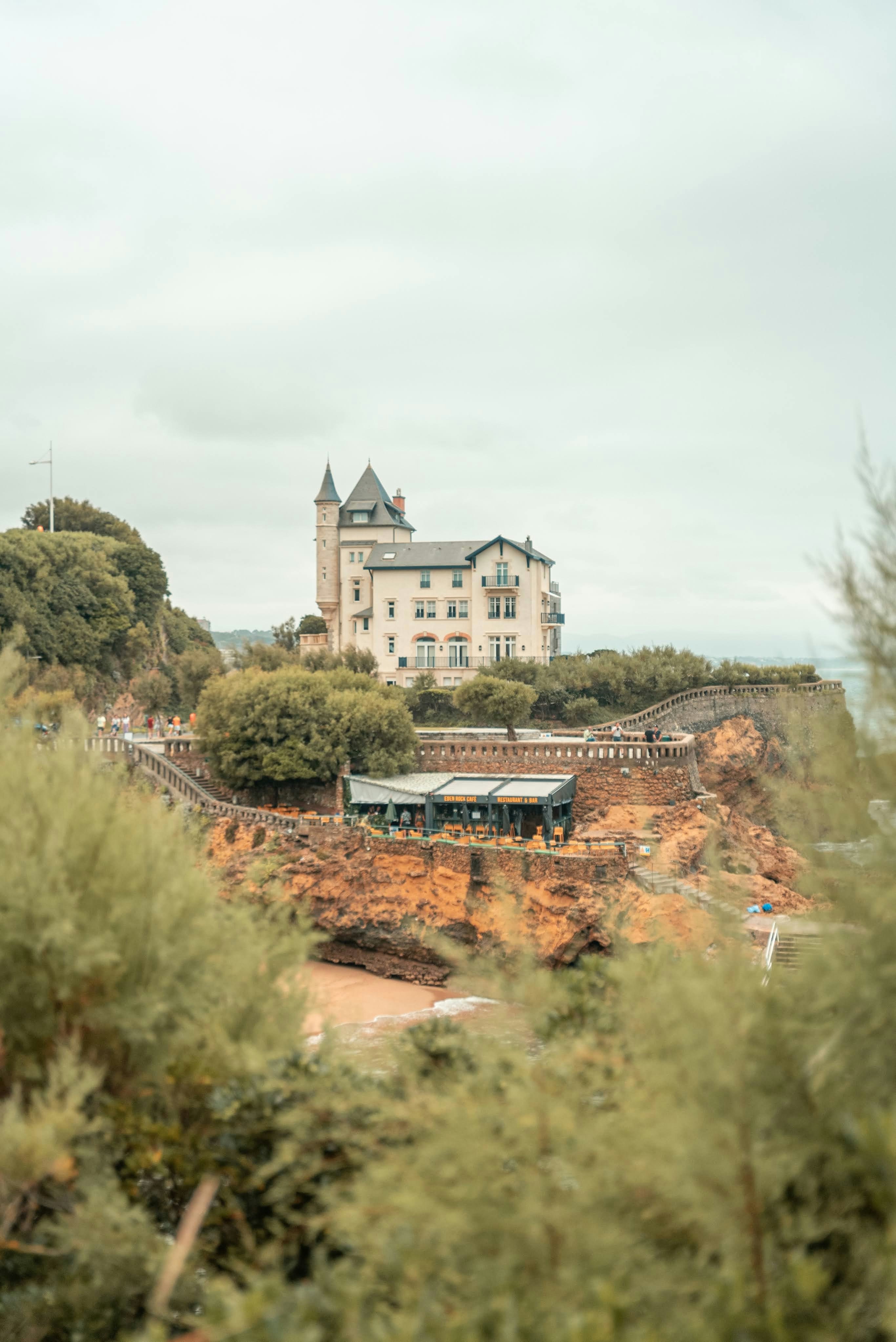 a large white building on top of a hill