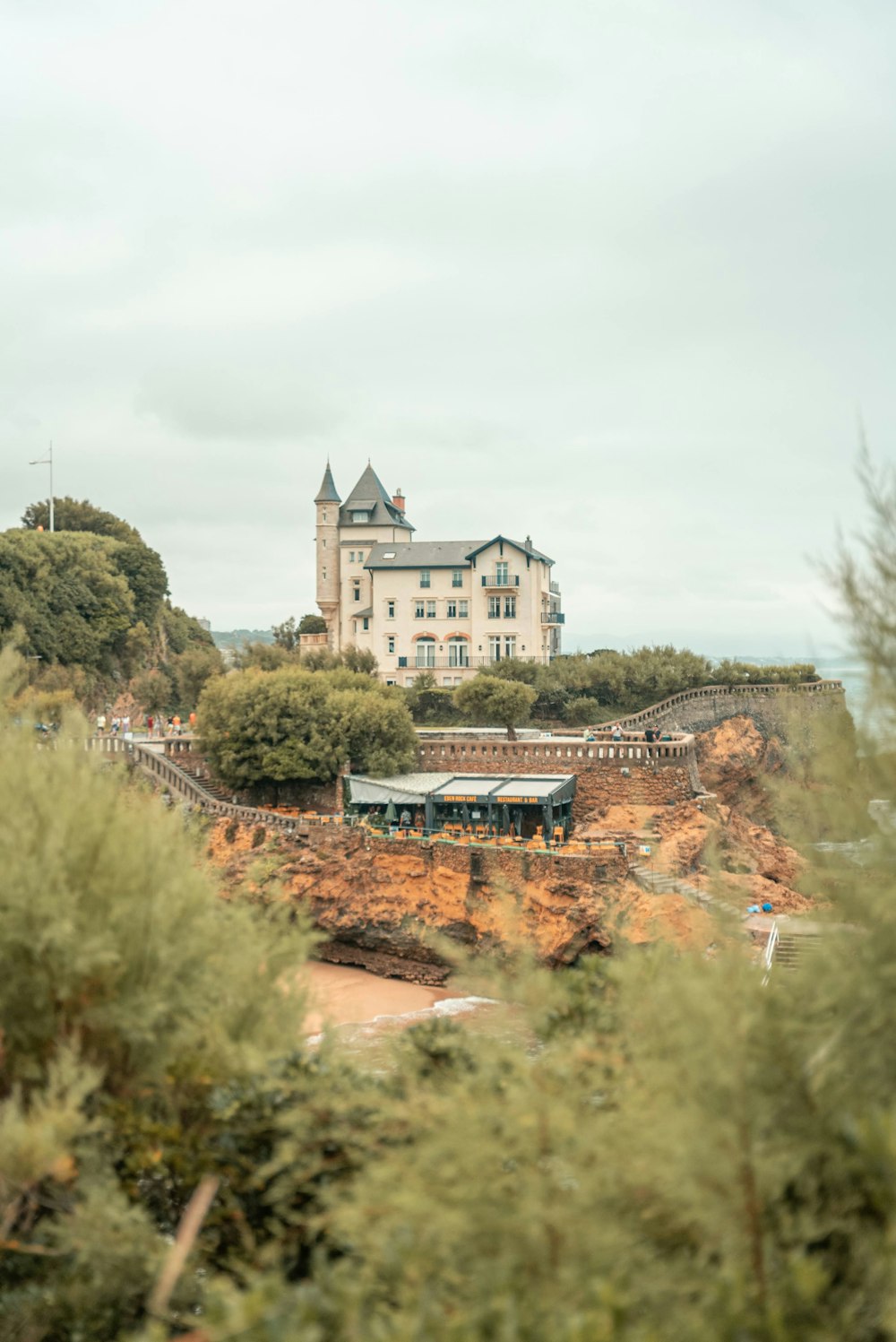 a large white building on top of a hill