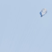 a kite flying in the sky on a clear day
