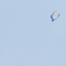 a kite flying in the sky on a clear day