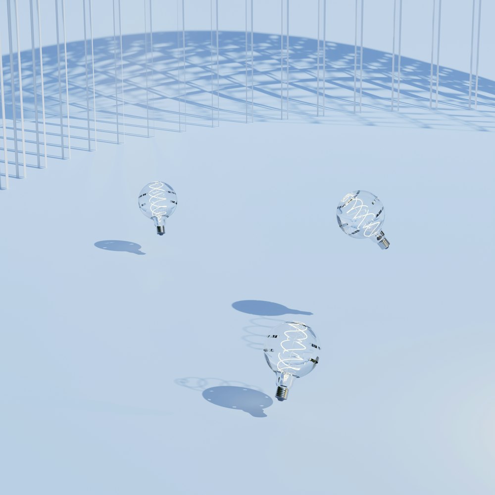 a group of light bulbs sitting on top of a snow covered ground