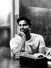 Recent photo showing a smiling person engaged in a hobby or work.