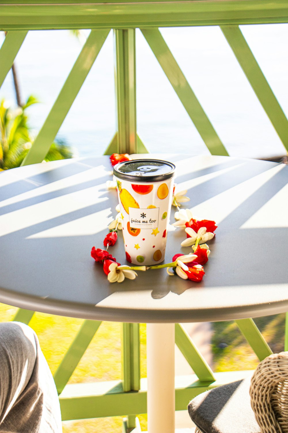 a cup of coffee sitting on top of a table