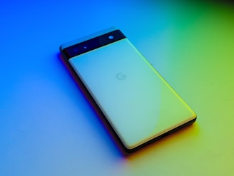 A compact smartphone with a unique design and color.
