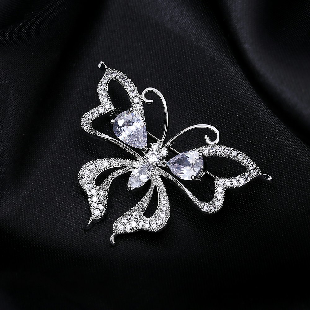 a brooch with a butterfly design on it