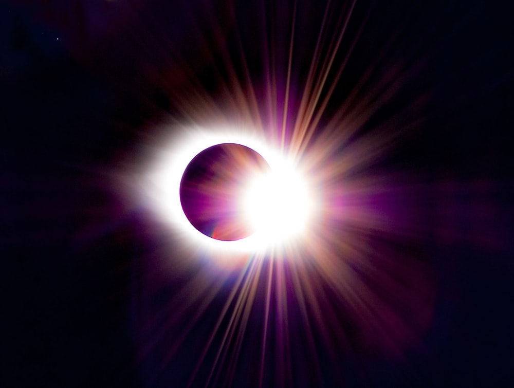 a solar eclipse is seen in the dark sky