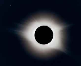 A breathtaking total solar eclipse casting a shadow over a historic Spanish town.