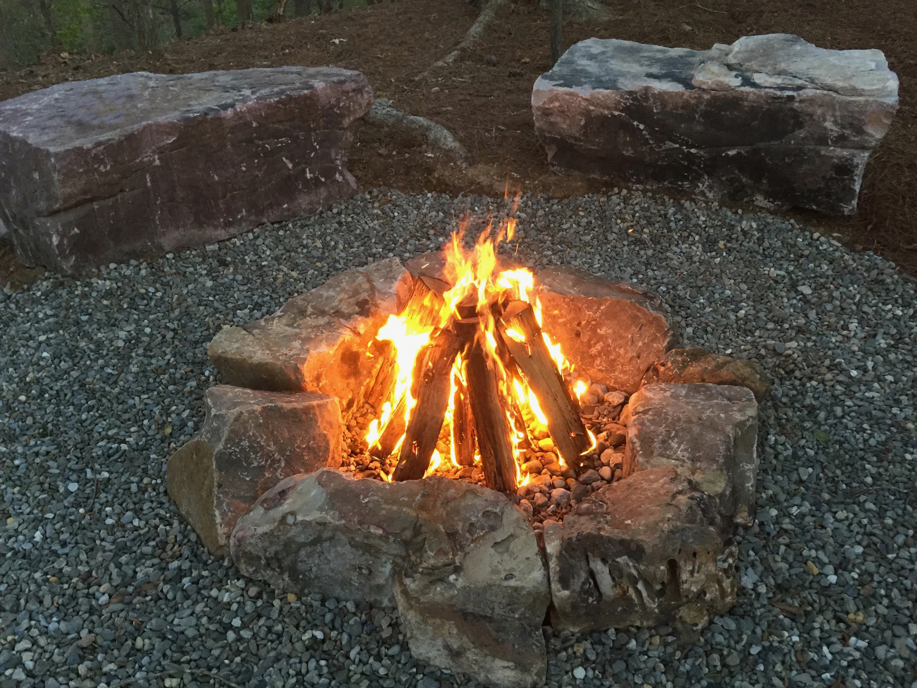 Outdoor fire pit surrounded by stone — inspiration photography