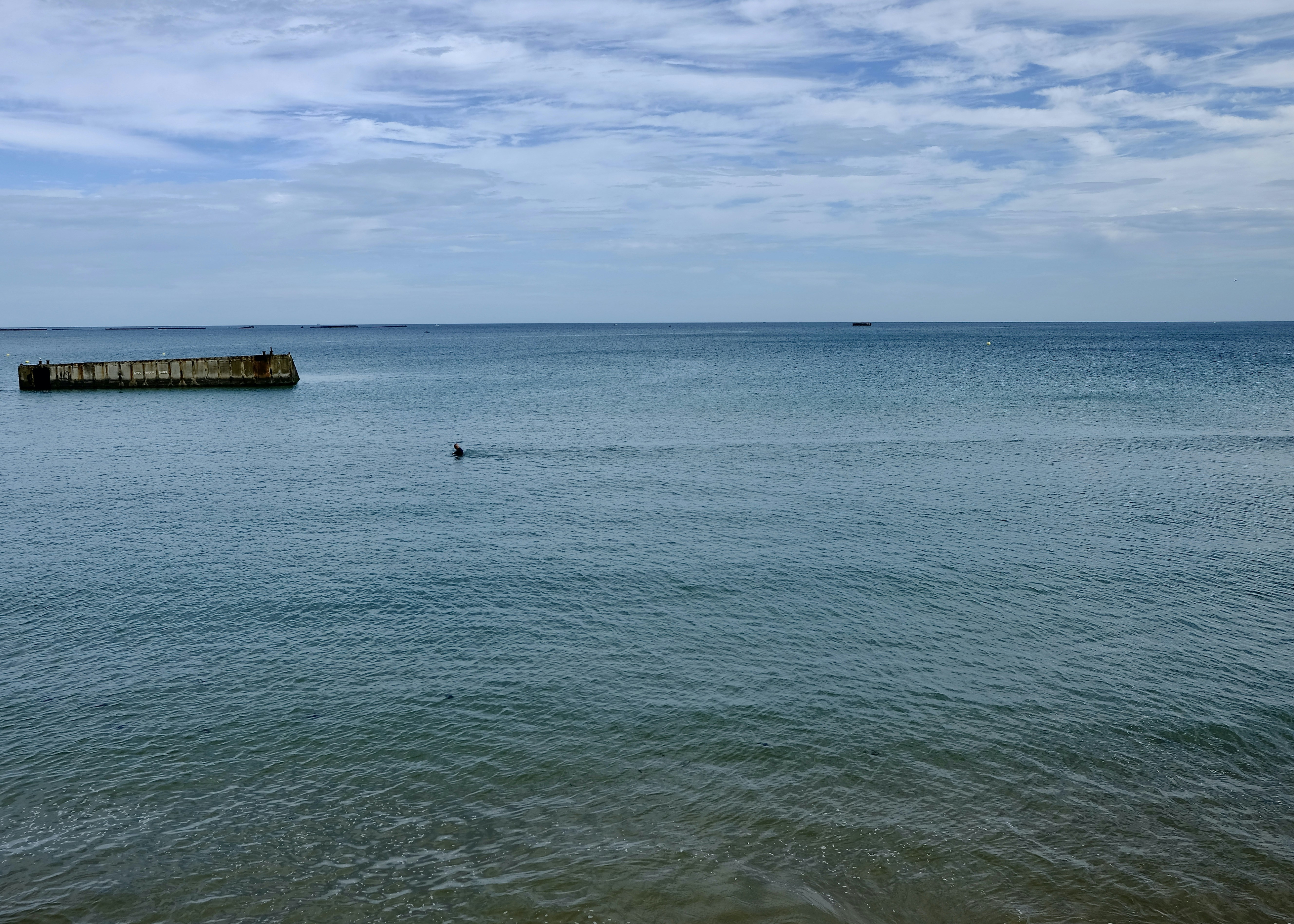 a body of water with a boat in the distance