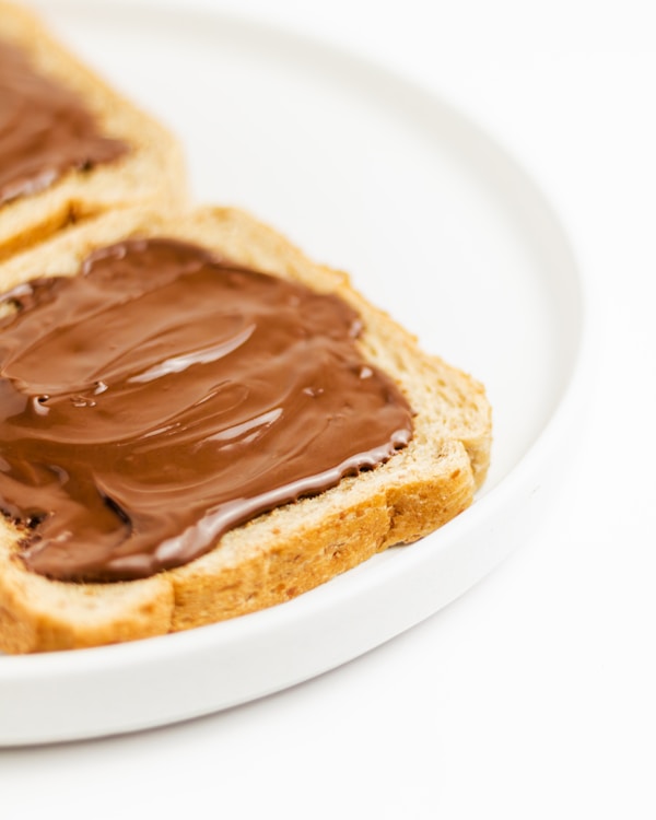 A peanut butter and jelly sandwich on a plate