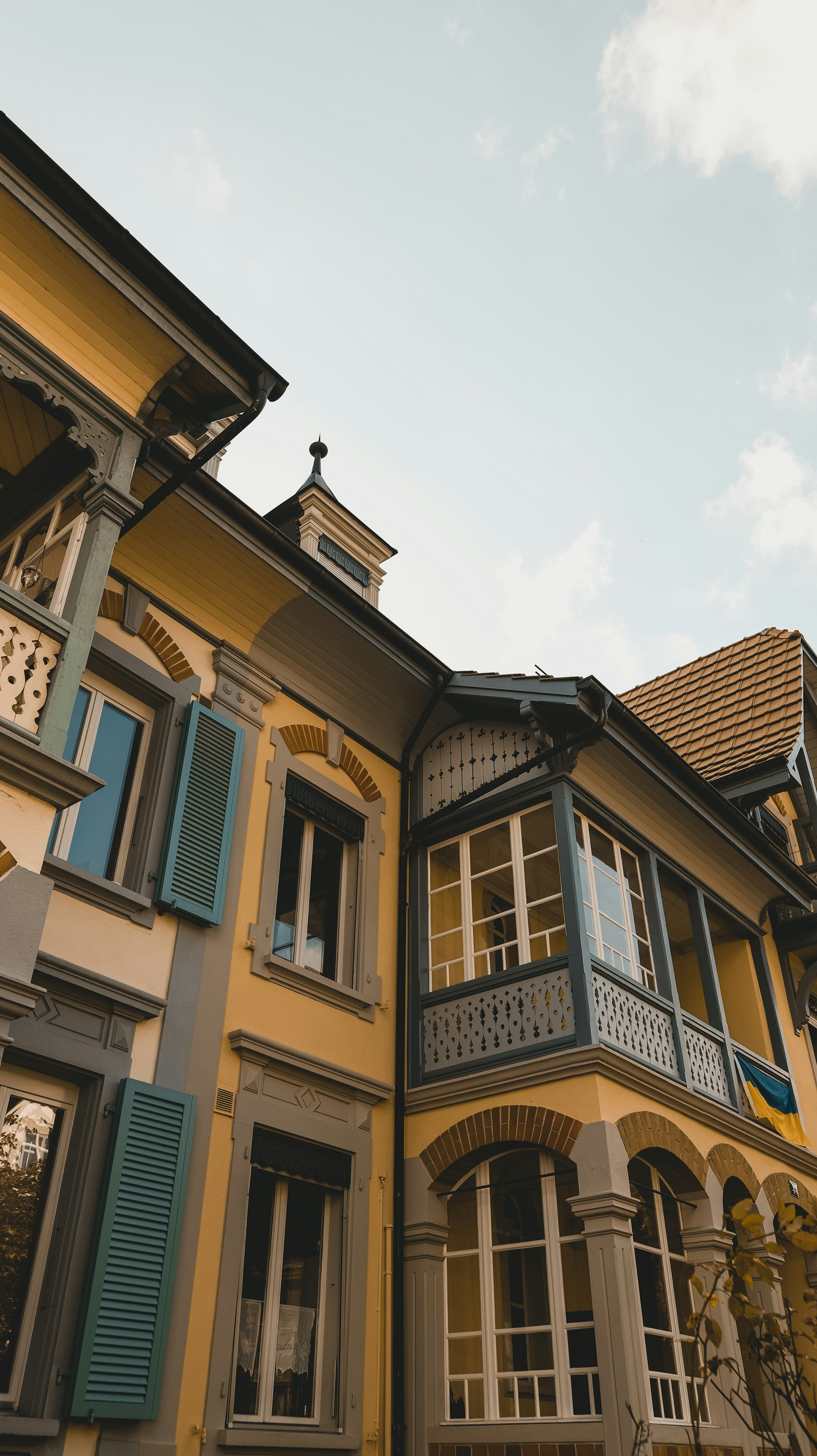 woman wearing yellow long-sleeved dress under white clouds and blue sky during daytime