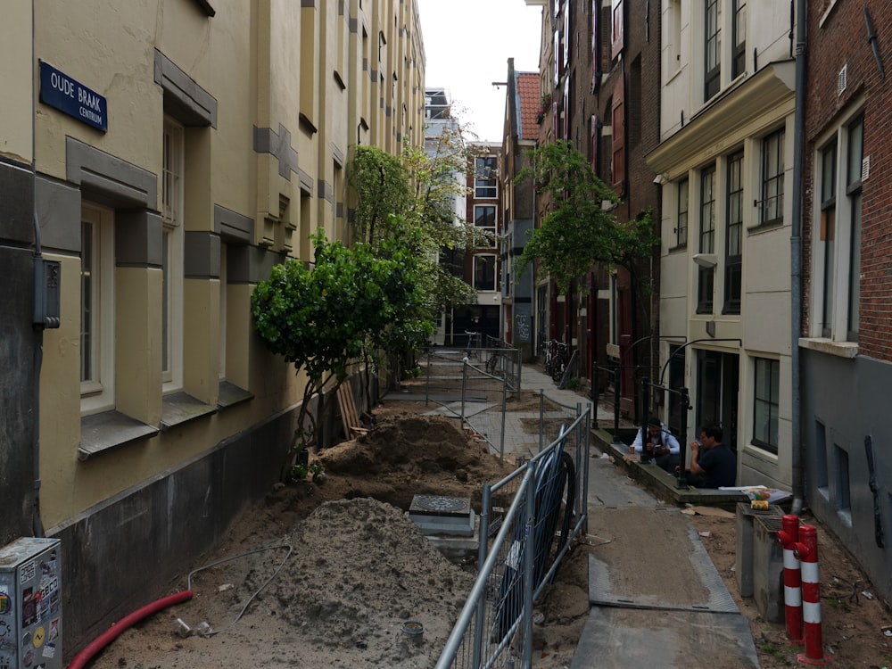 a narrow city street with lots of buildings