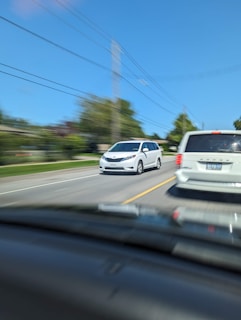 A family enjoying a road trip in a minivan.