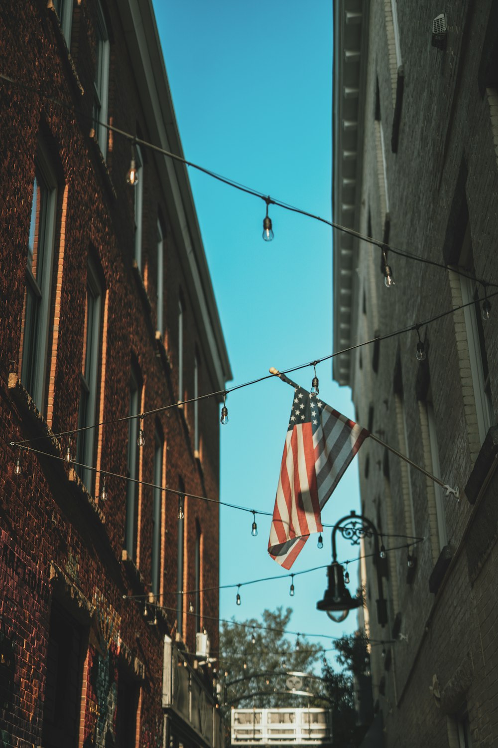 an american flag hanging on a clothes line