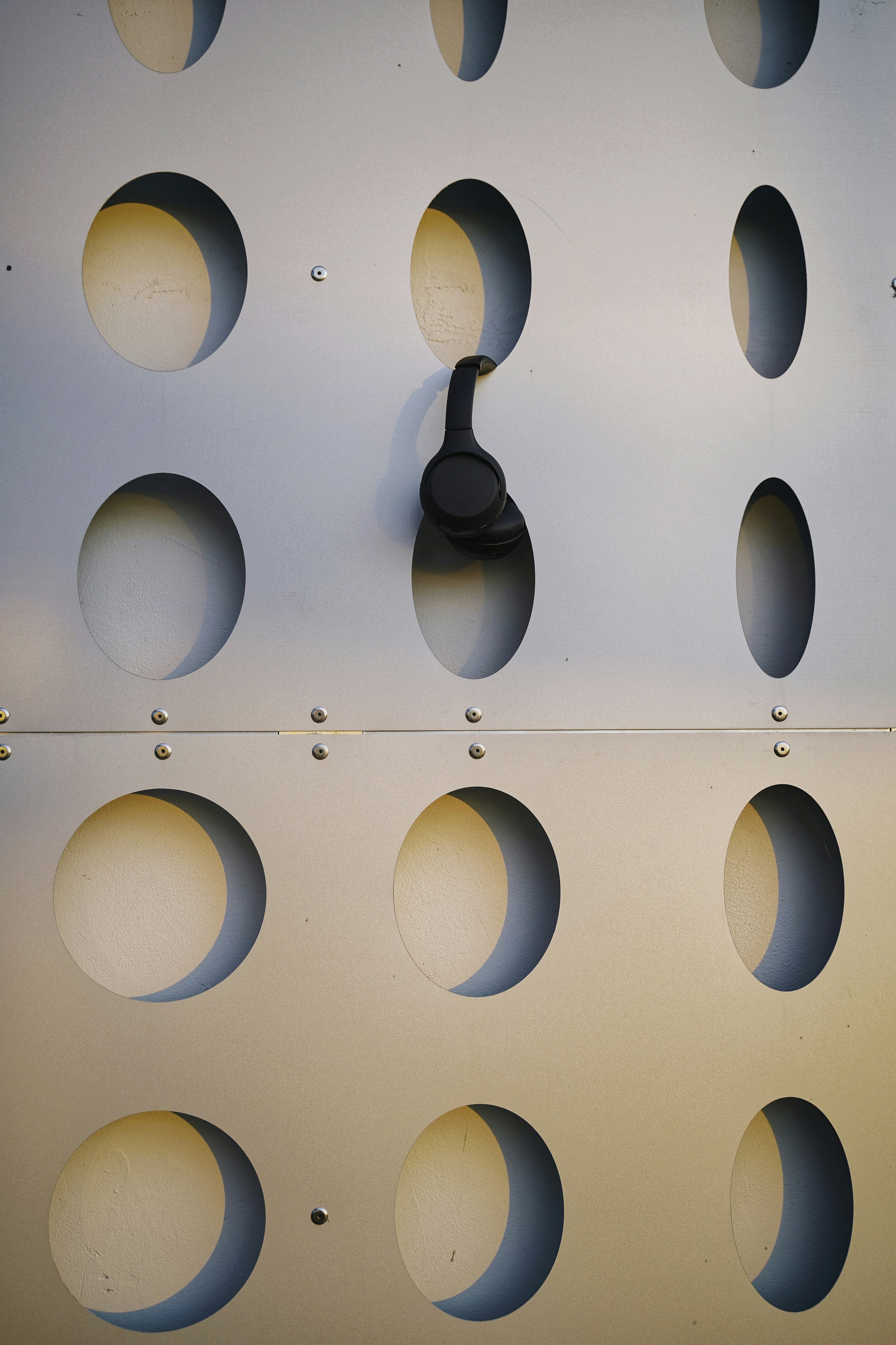 a wall that has a bunch of circles on it