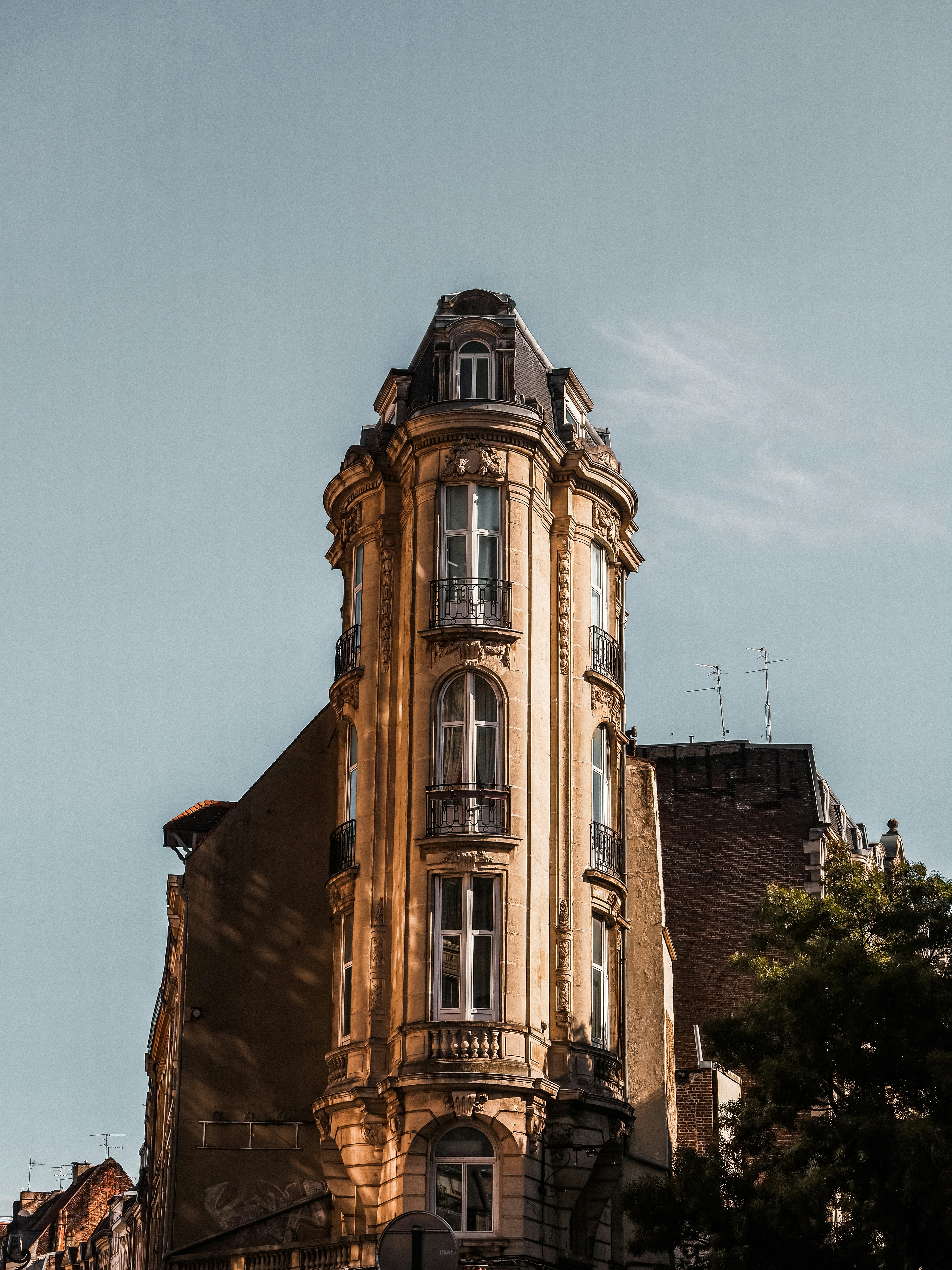 a tall building with a clock on the top of it