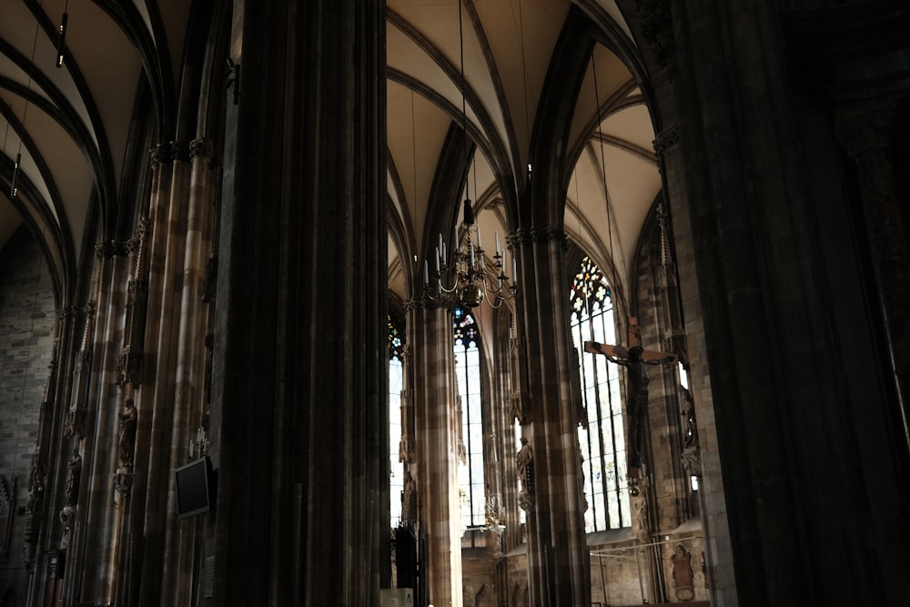 the inside of a cathedral with stained glass windows