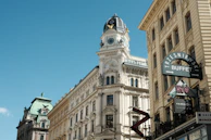 a tall building with a clock on the top of it