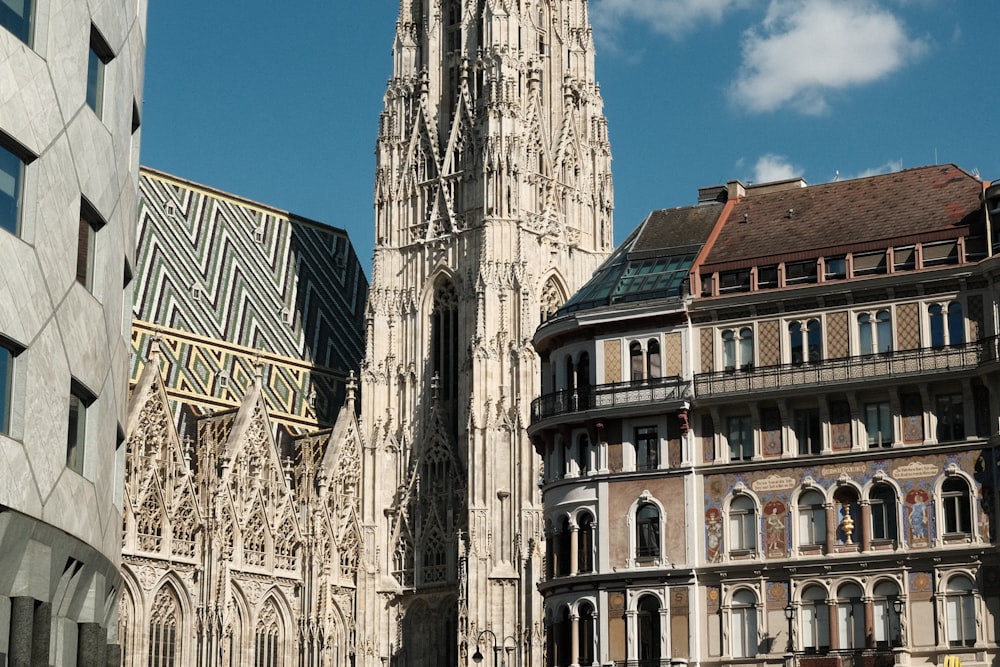 a large cathedral towering over a city filled with tall buildings