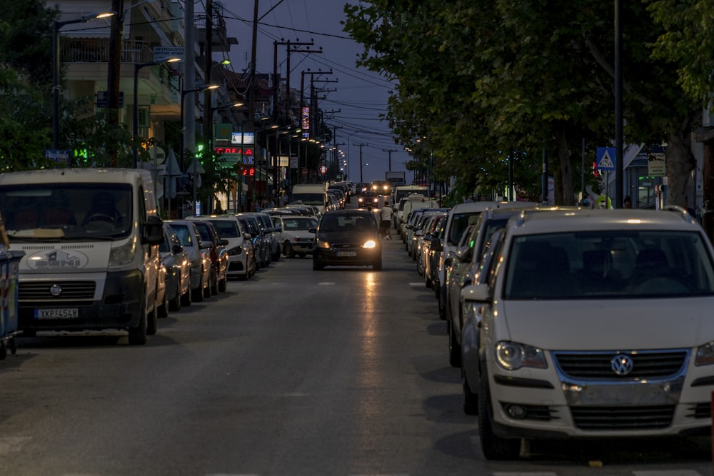 a city street filled with lots of traffic at night