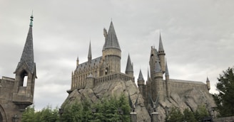 A dark fortress looming on a jagged mountain, with lightning crackling ominously above.