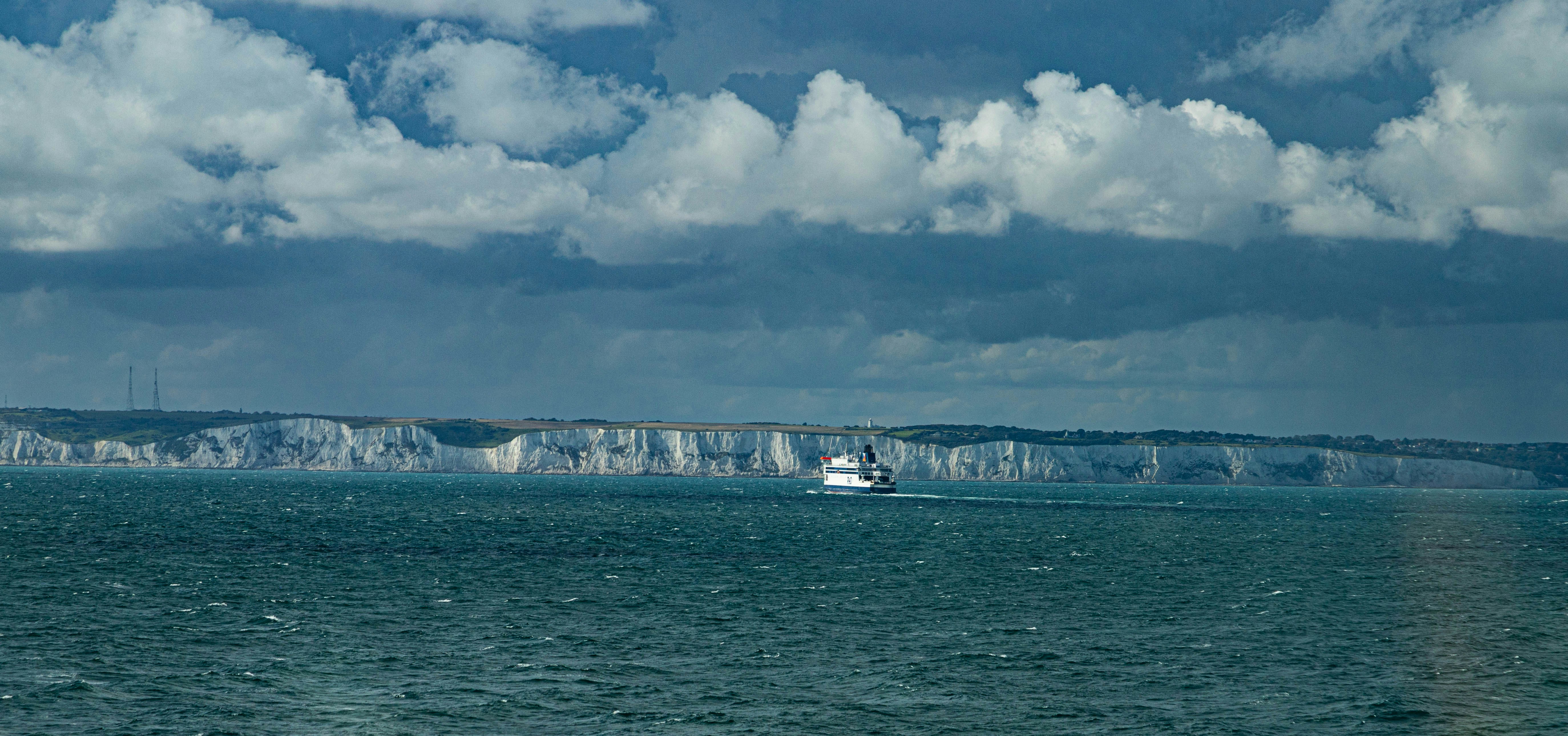 a boat is in the middle of a large body of water