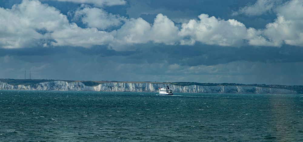 a boat is in the middle of a large body of water