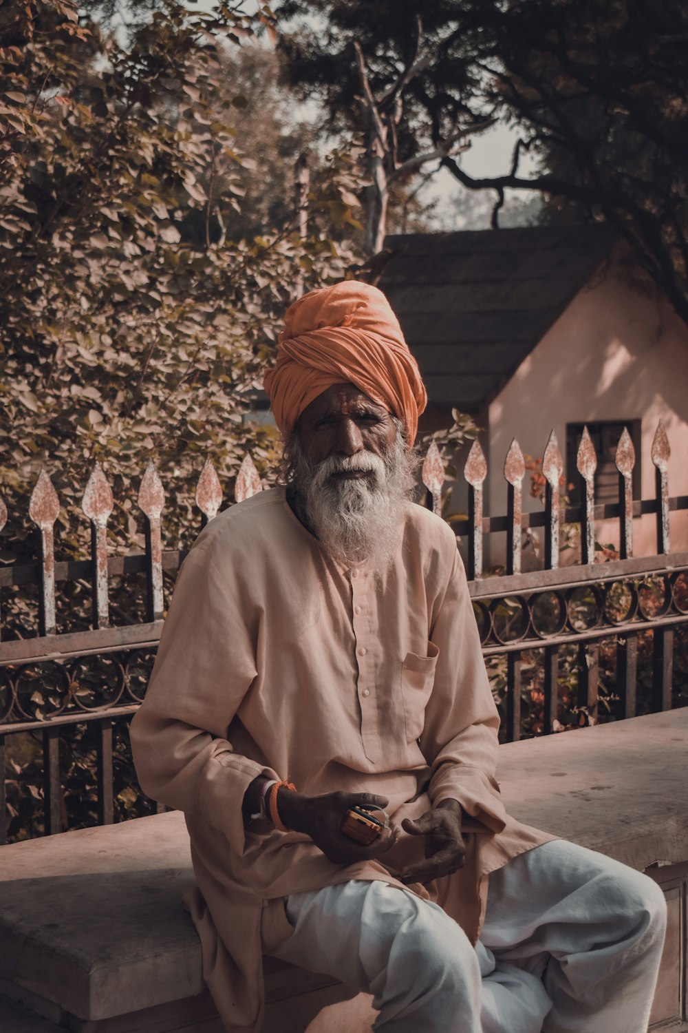 a man with a turban sitting on a bench