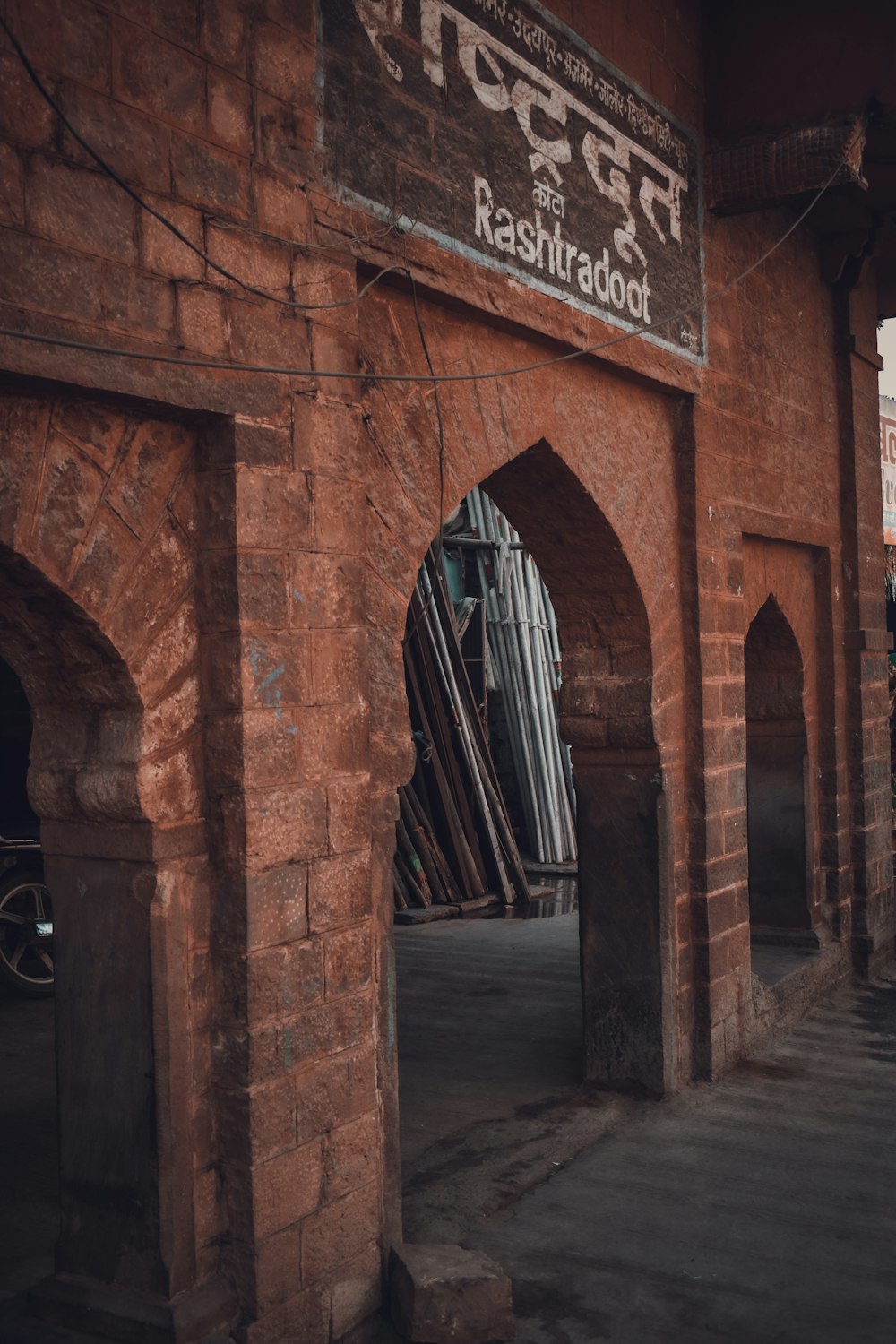 a brick building with a sign on the side of it