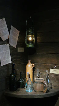 A warmly lit wooden tavern corner with ancient scrolls and a flickering candle casting soft shadows.