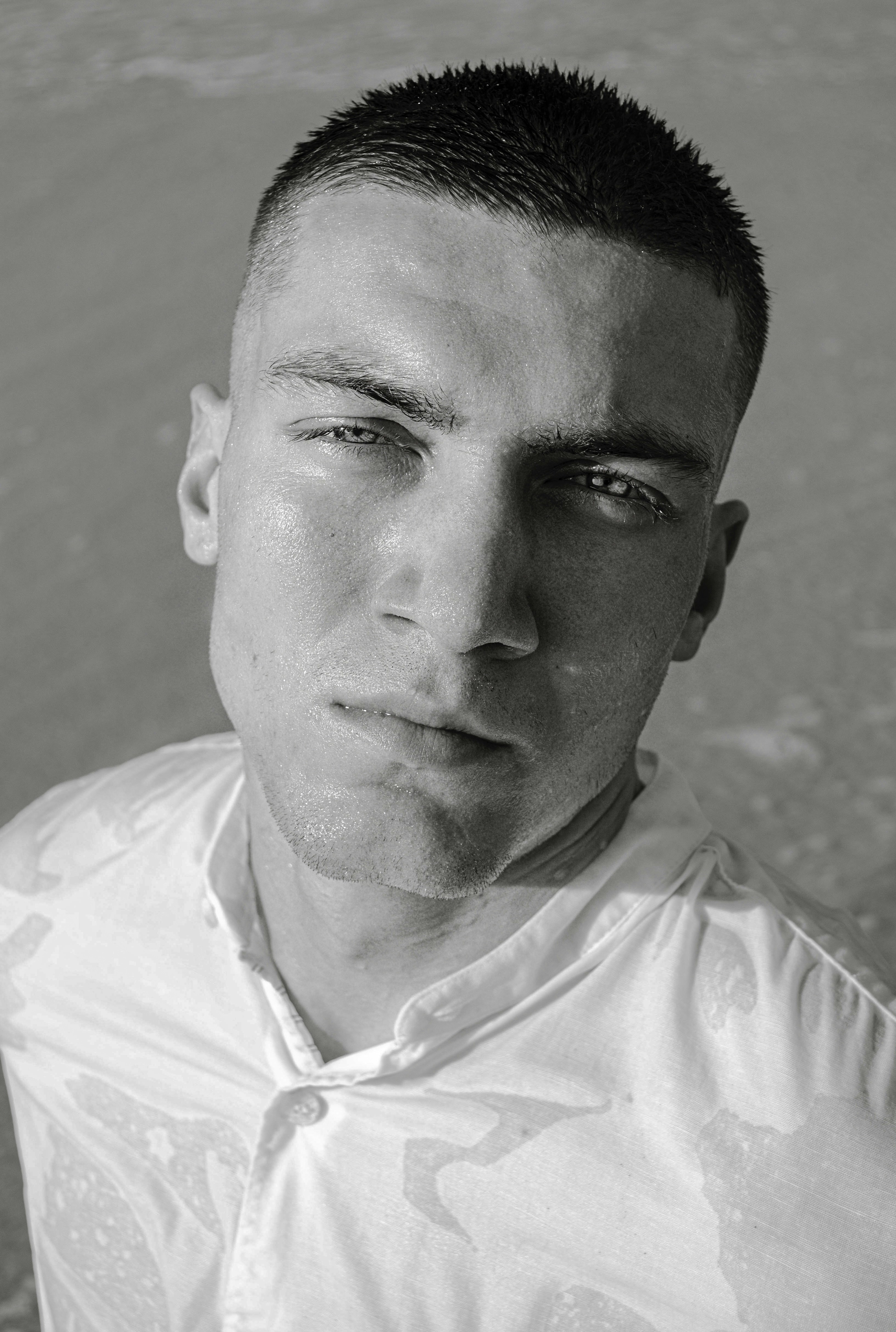 a black and white photo of a young man