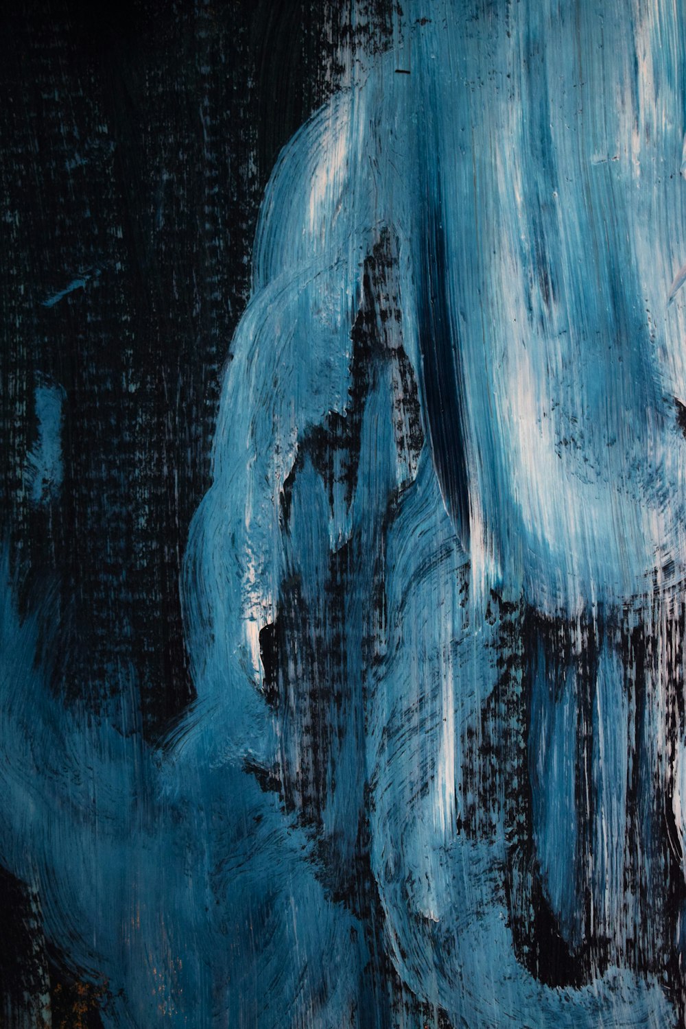 an abstract painting of blue and black colors