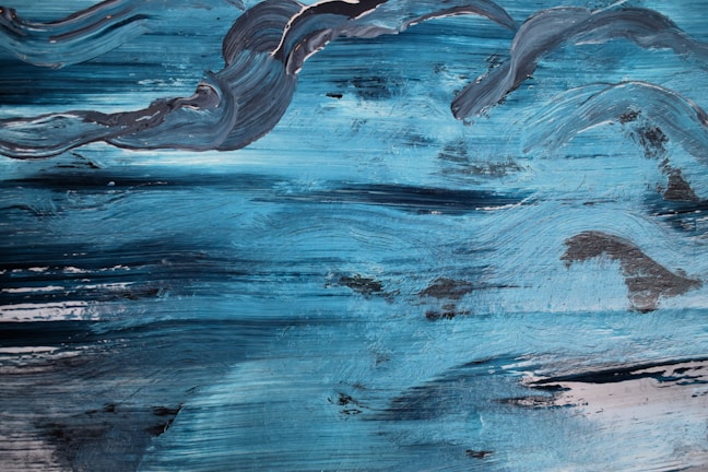 A textured canvas showing rhythmic brushstrokes in shades of blue, inspired by jazz improvisation.