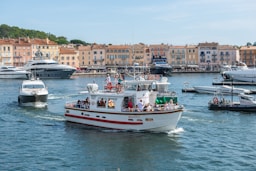 a group of people riding on the back of a boat
