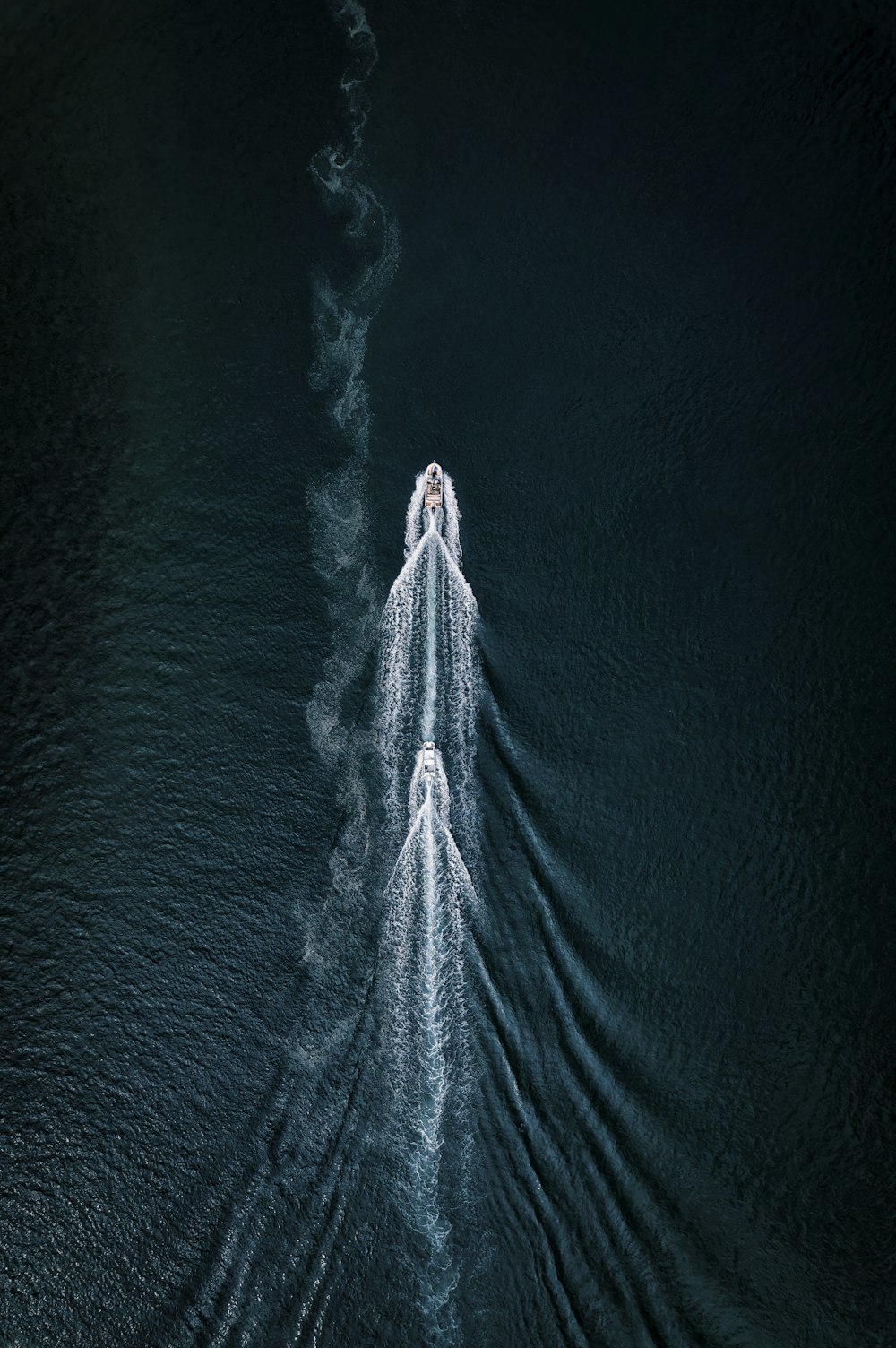 an aerial view of a boat in the water