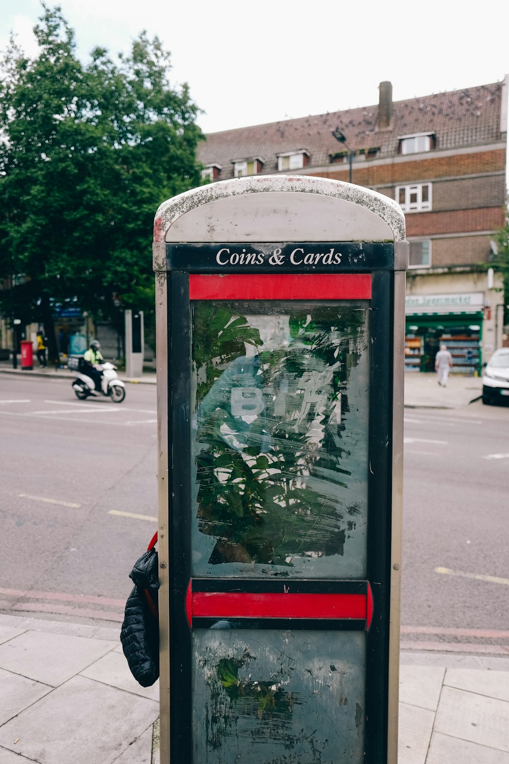 a public phone booth on a city street
