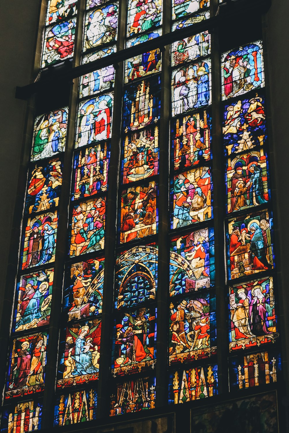 a large stained glass window in a church