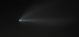 Starry night sky with a mysterious glowing object moving across