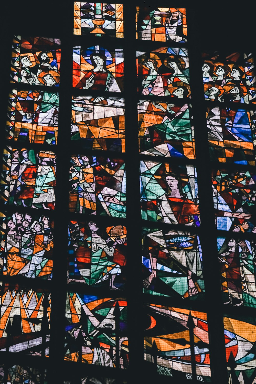 a large stained glass window in a church