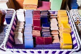 Stacks of finished ceramic tiles ready for shipment in a clean, organized warehouse.