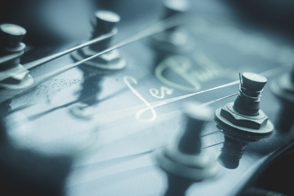 a close up of the knobs on a guitar